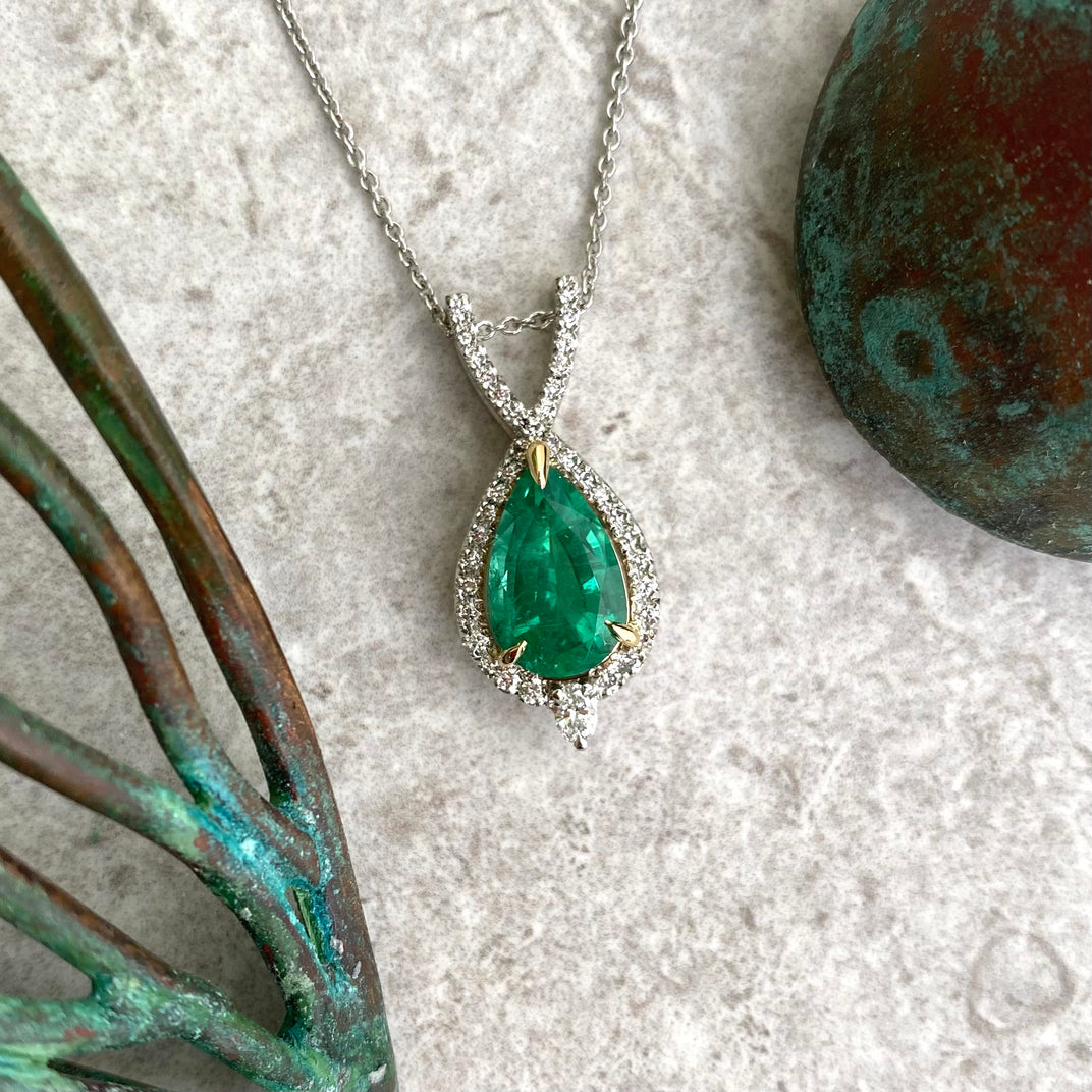 One of a Kind. Emerald diamond halo pendant
