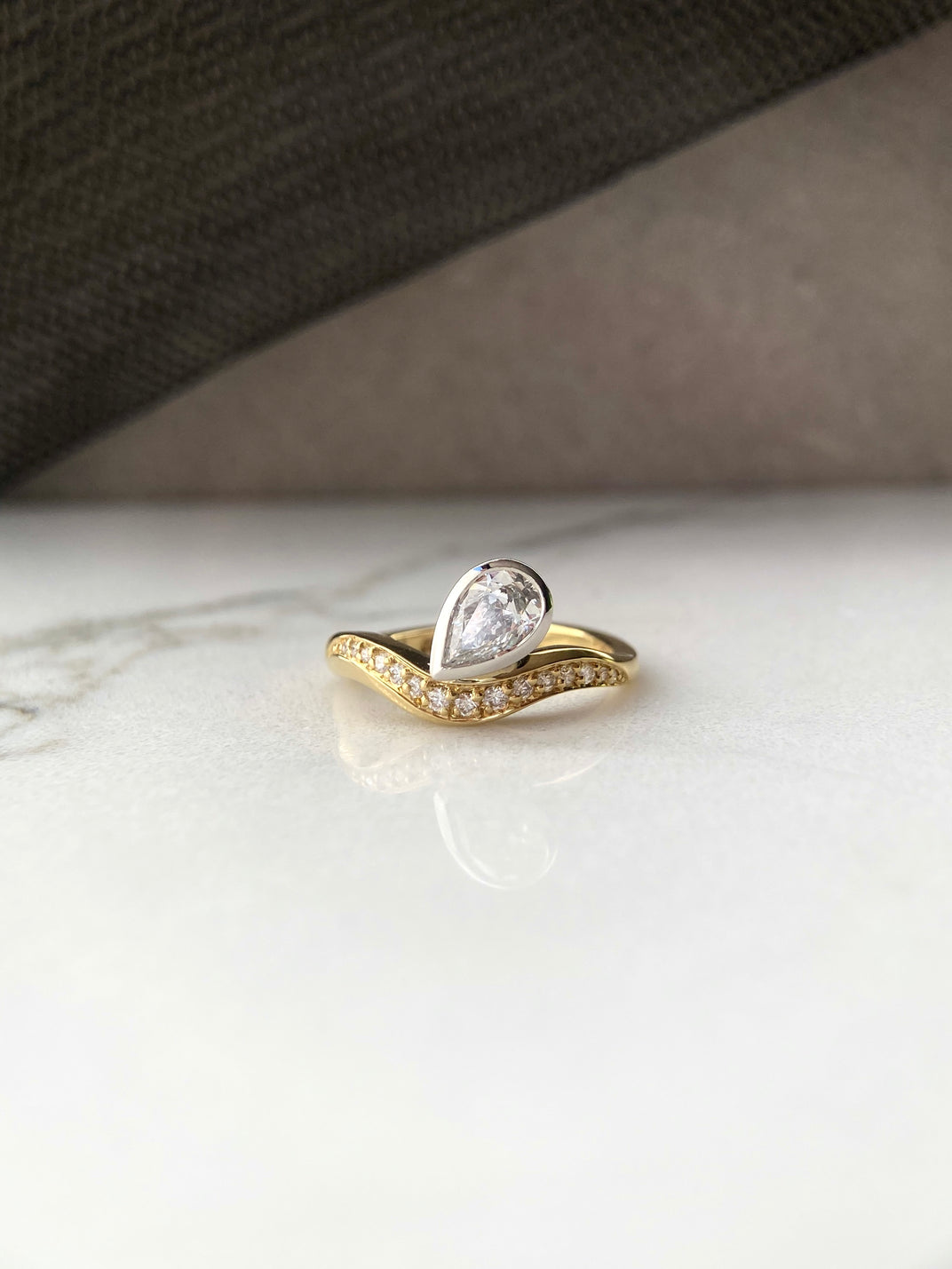 Signature. Curve Pear Shape Diamond Ring
