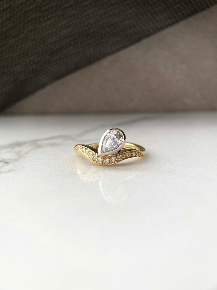 Signature. Curve Pear Shape Diamond Ring